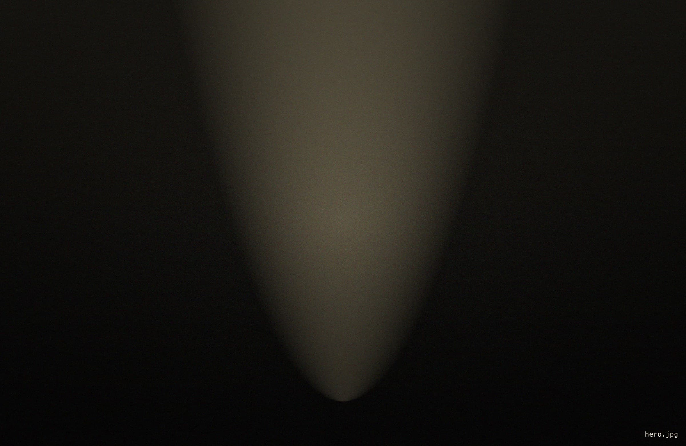 Light falling through the dark arches of a gothic interior
